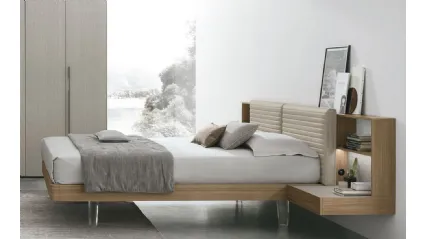 Letto Yuki in materico noce con testiera in ecopelle Tomasella